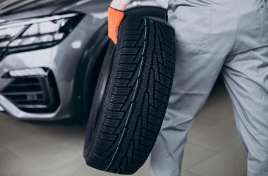 Mechanic changing tires in a car service